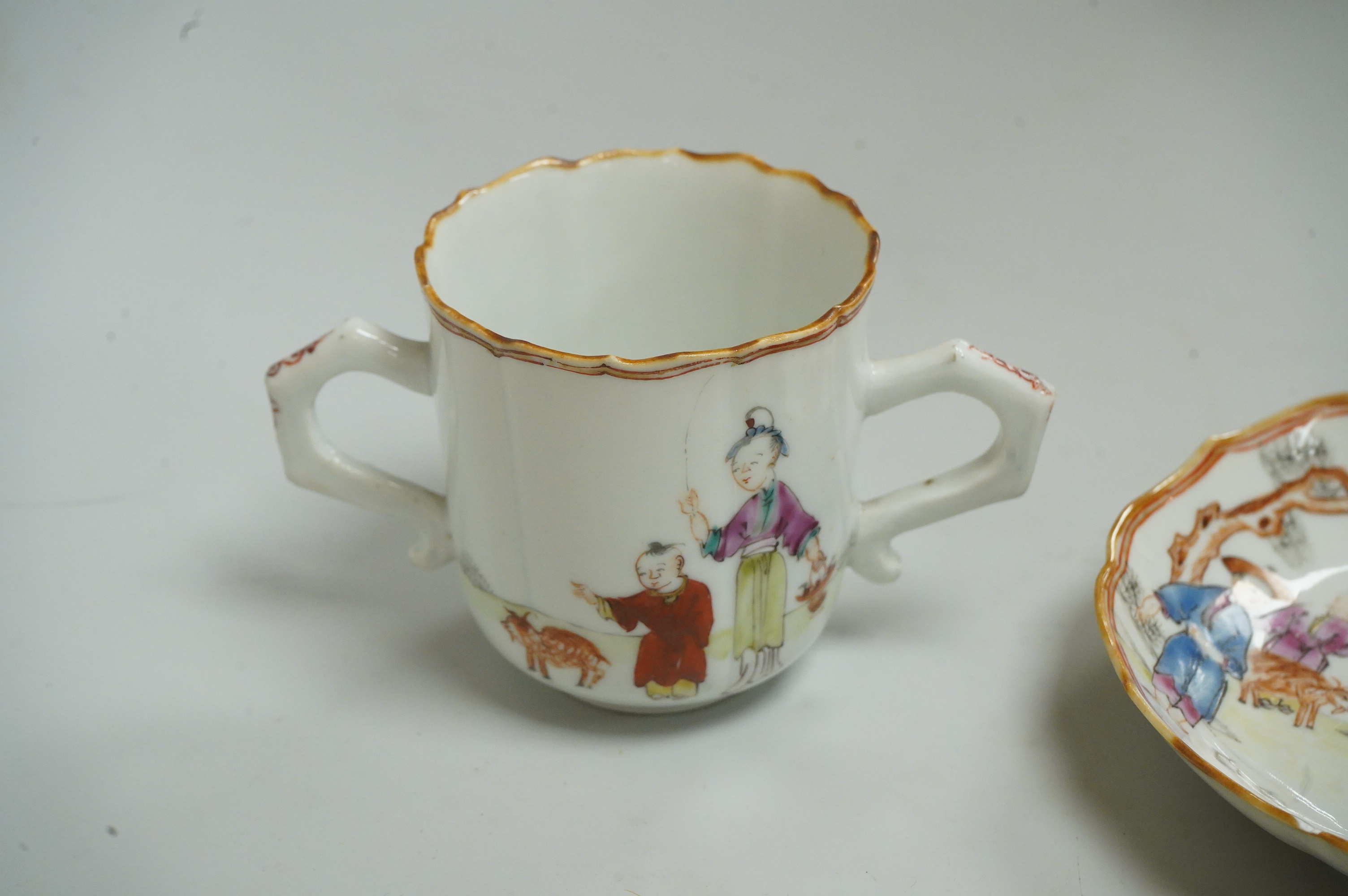 A Chinese export famille rose chocolate cup and trembleuse saucer, Qianlong period, saucer 13cm in diameter